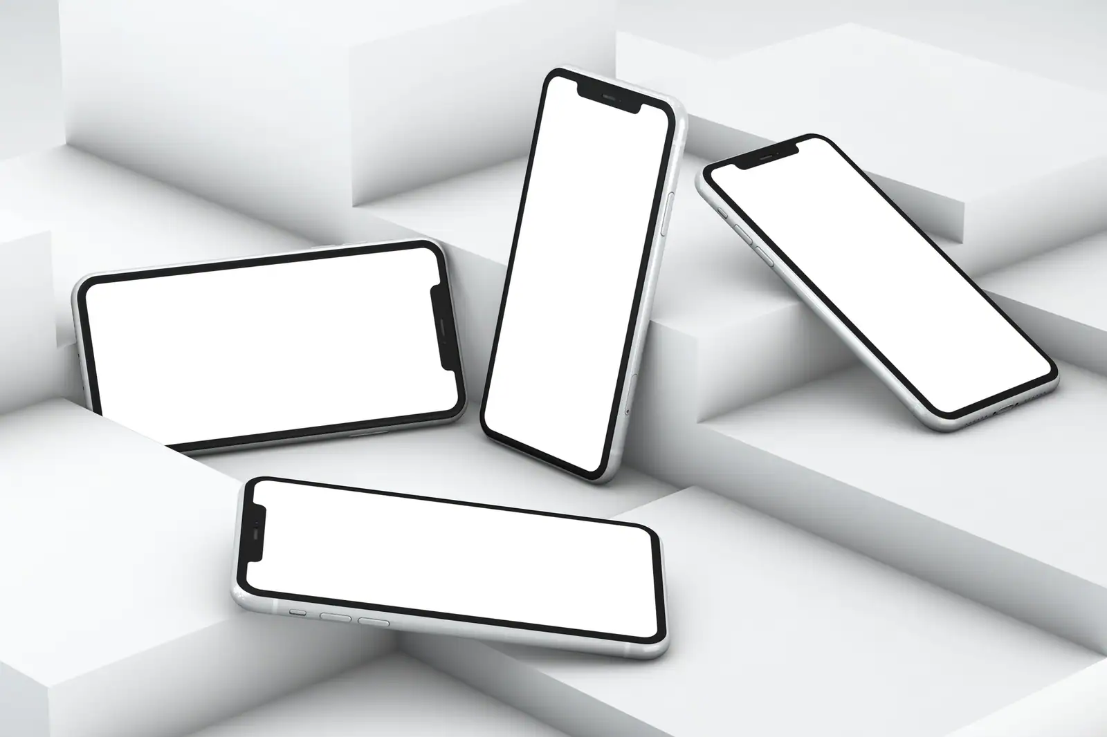 Plusieurs smartphones à écran vierge disposés sur un fond géométrique blanc, prêts pour un mockup